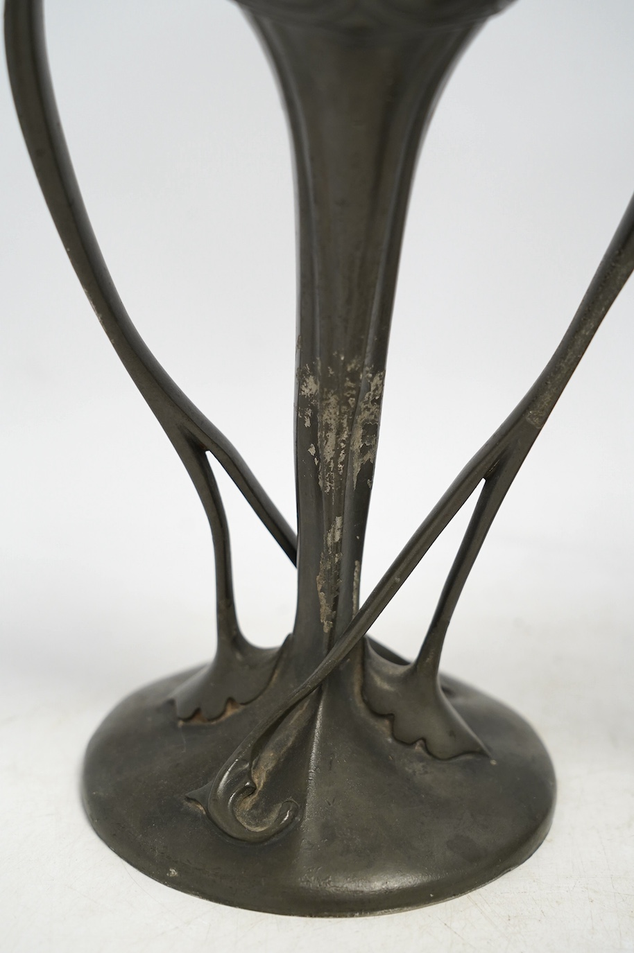 A pair of Art Nouveau Liberty Tudric pewter twin-handled vases, stamped to the bases, 25cm high. Condition - one good, the other poor to fair
